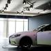 The Lexus model IS is stationed to drive off the stage at the North American International Auto Show on Tuesday, Jan. 15. Daniel Brenner I AnnArbor.com